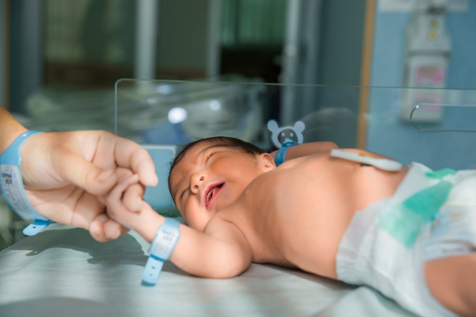 Pediatrician caring for a newborn during a vaccination visit