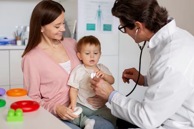 Pediatrician checking the vaccination record of a baby during a routine visit