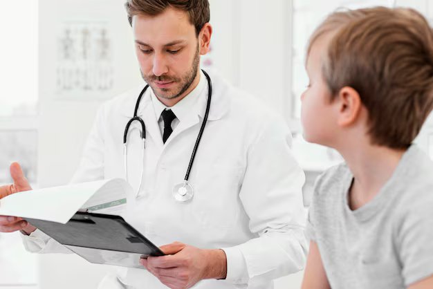 Pediatrician reviewing a child's vaccination card for missed doses