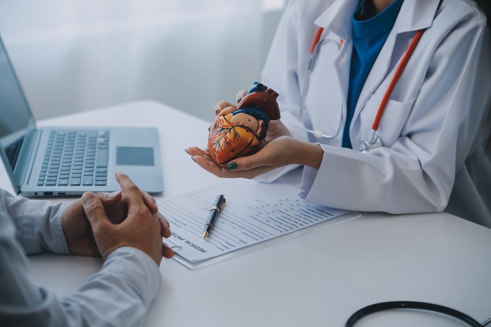 Cardiologist explaining how hidden heart disease risk factors can exist even when blood pressure is normal.