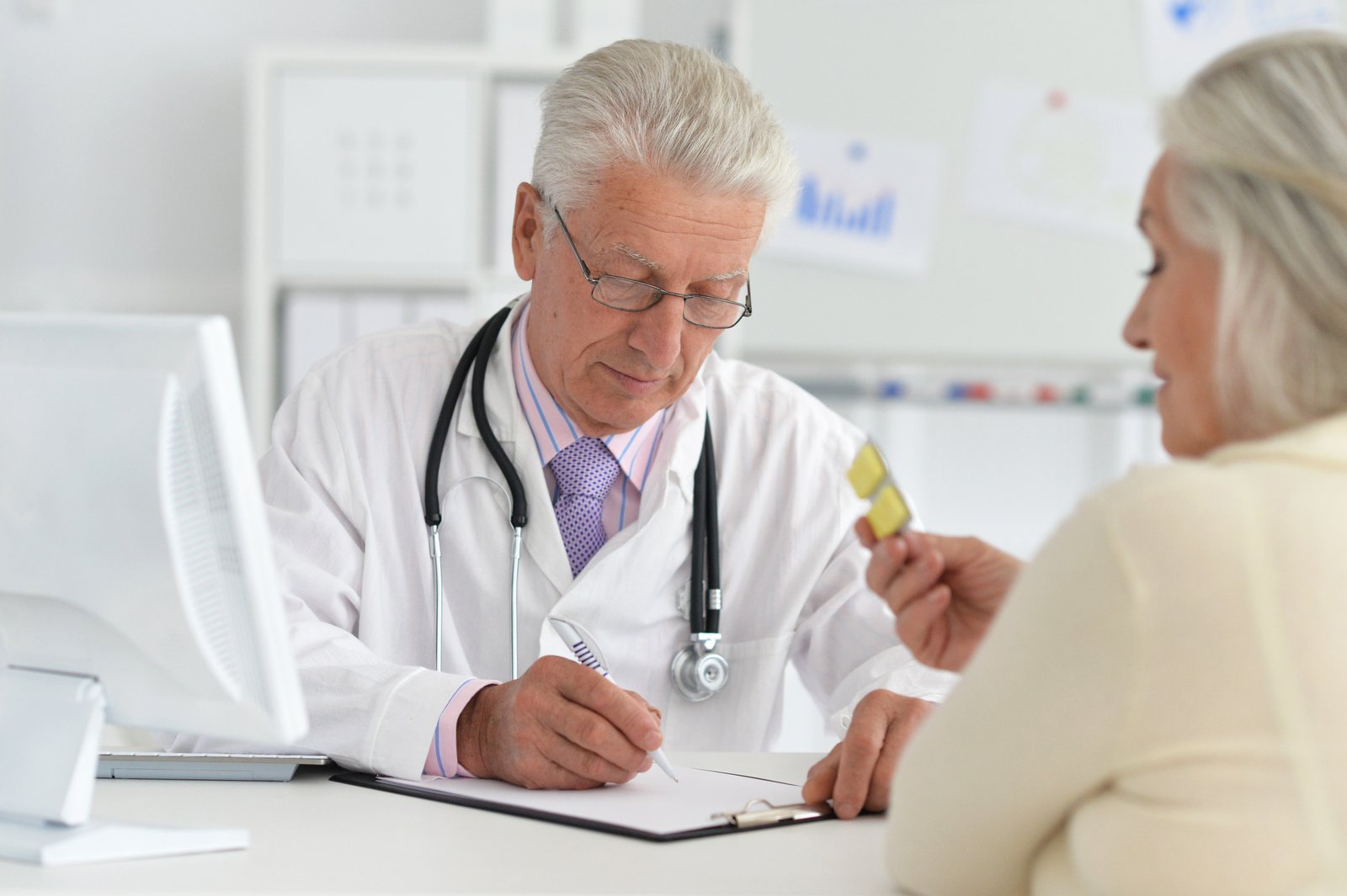 Cardiologist discussing hidden heart disease risk factors such as cholesterol, diabetes, and lifestyle habits with a patient.
